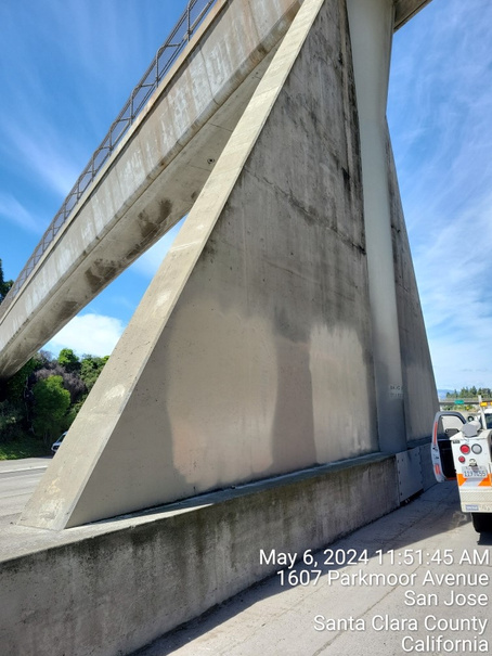 Photograph of a pedestrian overcrossing in Santa Clara County where graffiti has been painted over.