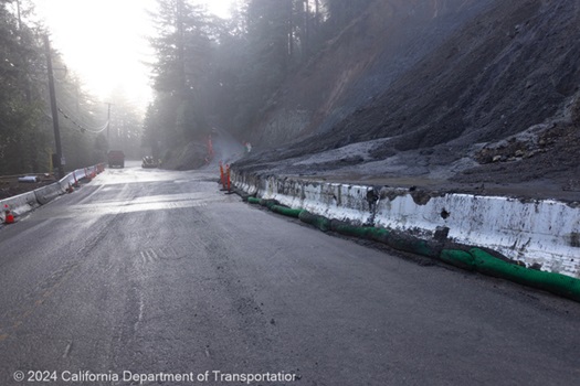 Concrete barriers separate slide debris from the lanes of travel on State Route 9 near Saratoga.
