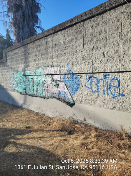 A soundwall in Santa Clara County that has been defaced with graffiti.