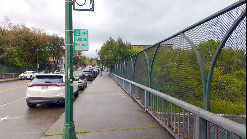 Cars parked next to the pedestrian sidewalk on the Main Street overcrossing in Los Gatos.