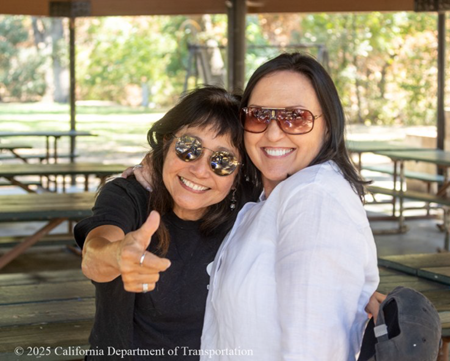 Two women in sunglasses pose for the camera at the worker appreciation event for the Solano I-80 Express Lanes project.