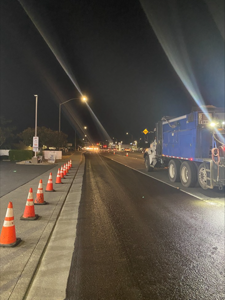 Orange traffic cones line State Route 113 in Solano County while a truck sits next to a lane that's been "dug out" as part of the pavement rehabilitation process.