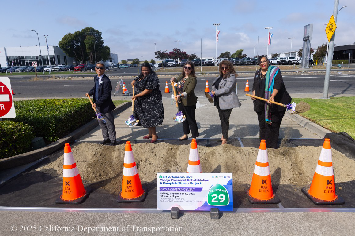 Five people use shovels to scoop dirt as part of the groundbreaking ceremony for the State Route 29 Pavement Rehabilitation & Complete Street Project on September 12, 2025.