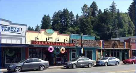 Cars are parked in front of shops on State Route 116 in Guerneville.