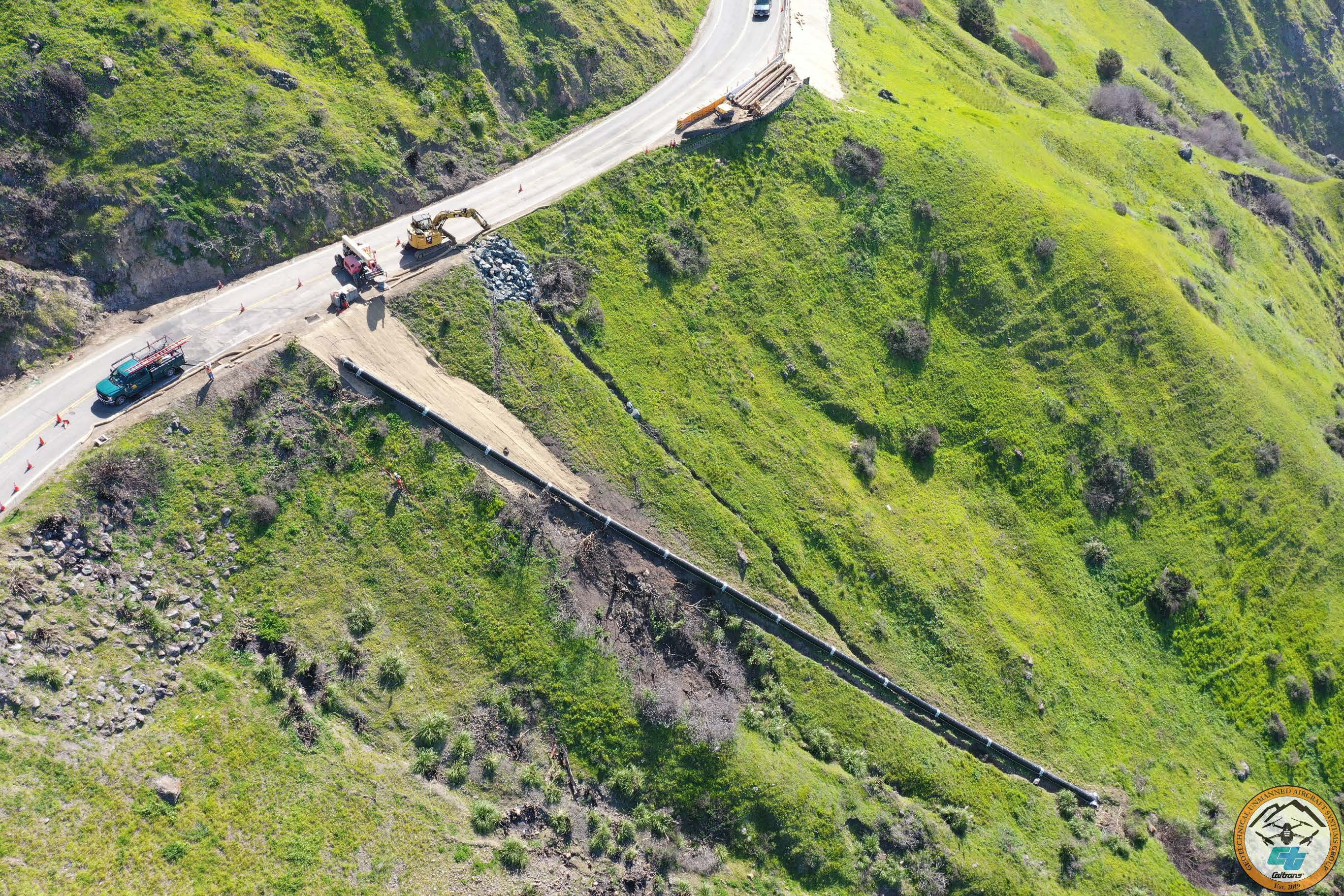 Image of where a new culvert is being installed on Hwy 1 in northern Sonoma County, augmenting the smaller culverts that drain the slope.