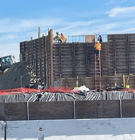 Workers building the retaining wall on the east side of the freeway for the Hearn Avenue Overcrossing project in Santa Rosa.