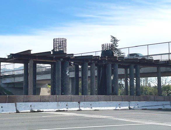 Image of 120-foot girders will be placed on columns in the center median and on the abutment on each side of the freeway. for the Hearn Avenue Overcrossing project in Santa Rosa.