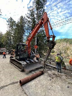Caltrans crew and excavator working on Route 116 Emergency Slide Repair Project west of Guerneville.