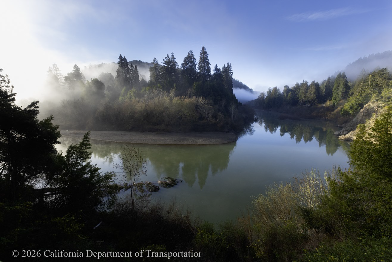 Picturesque scene of fog lift-ing on the Russian River, showing why people love living in the Russian River valley.