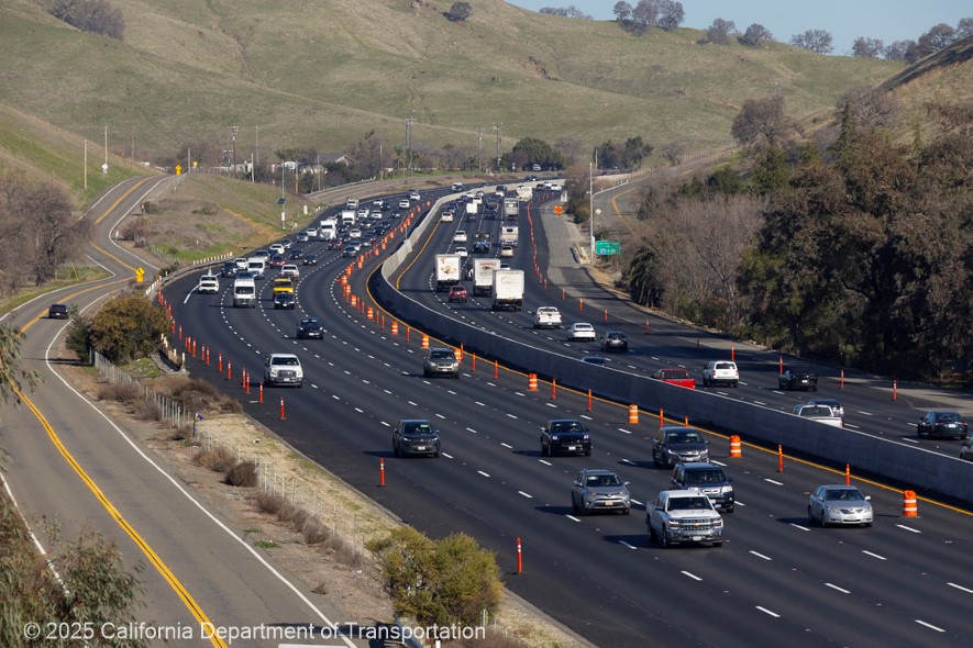 Interstate 80 in Solano County between Vacaville and Fairfield. Cones block traffic from entering the new lane.
