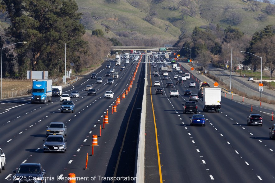 Interstate 80 in Solano County between Vacaville and Fairfield. Cones block traffic from entering the new lane on the westbound side.
