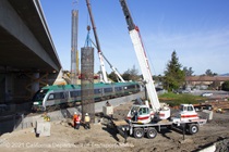 A SMART train passes by the construction area for the Marin Sonoma Narrows Project. Photograph taken April 2021