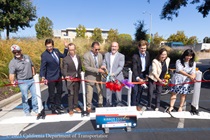 A red ribbon is cut to commemorate the the completion of the State Route 82 (SR-82) El Camino Real Paving Rehabilitation Project.