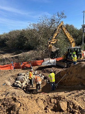 crews placing drainage systems for the new bridge.