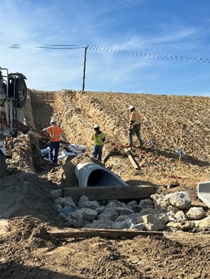 crews placing drainage systems for the new bridge.