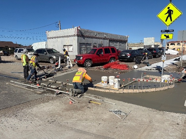 Crews actively laying cement for the upgraded ADA compliant sidewalks in Guadalupe.