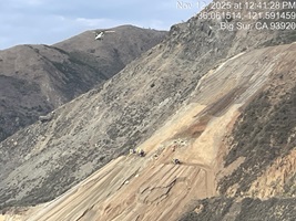 Photo showing helicopter bringing necessary supplies to Regent's Slide construction zone