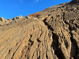 Photo of hillside with ropes and other tools used to secure the ground
