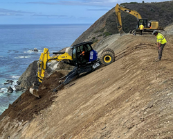 Photo of construction staff in heavy equipment working on Regent's Slide