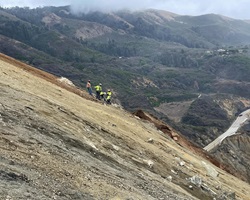 Photo of construction crews scaling the side of the hill