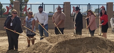 Photo image of a group of people with shovels at a Clean California ground breaking event.