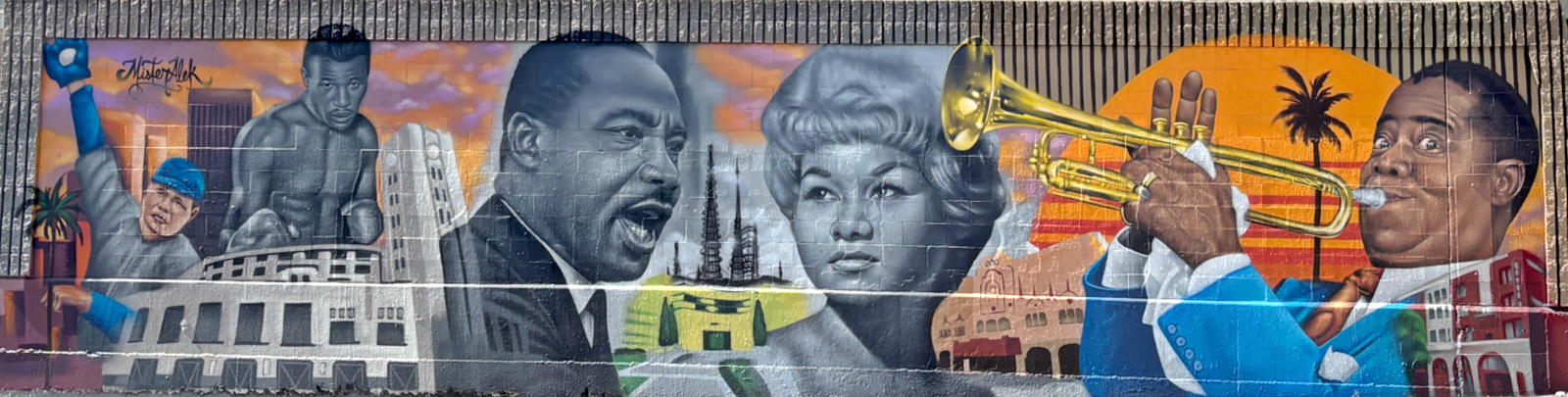 The mural “Jazz on the Field” by artist MisterAlek at 43rd Street and Grand Avenue in Los Angeles. Jazz on the Field by artist MisterAlek celebrates the cultural heritage of Wrigley Field, a ballpark formerly located at 425 E. 42nd Place, and The Dunbar Hotel at 4225 S. Central Avenue—both a short distance from the mural site.   Before it was demolished in 1969, Wrigley Field was home to the Los Angeles Angels and Hollywood Stars of the Pacific Coast League. It was also a venue for boxing events, The Calvacade of Jazz in the 1940s and 1950s, and the historic Los Angeles Freedom Rally on May 26, 1963, when Rev. Dr. Martin Luther King Jr. addressed a crowd of nearly 40,000 people during the civil rights movement. The Dunbar Hotel was a hub for Los Angeles’ jazz scene with artists such as Etta James and Louis Armstrong.