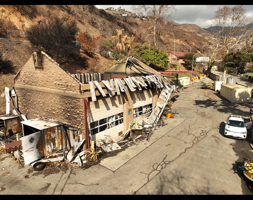 A burned equipment building and other damage at Las Flores Maintenance Station is shown after the 2025 Palisades Fire