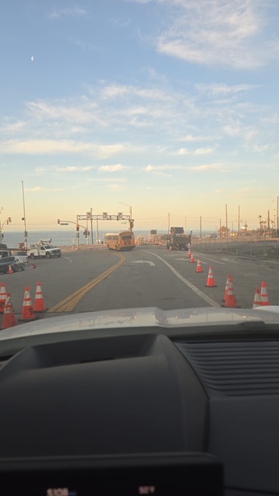 Photo showing paved road line with orange cones along SR-27