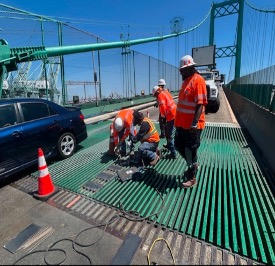 Workers shown working on bridge