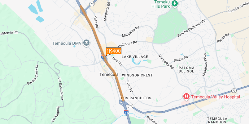 Ariel map of Interstate 15 surrounded by the city of Temecula. I-5 runs in a vertical north and south direction, with the city to the east. The map also shows two connect routes, State Route 74 and State Route 79 that come at a horizontal connection to the interstate. The map highlights  in orange the project zone from Temecula Parkway to Winchester Road.