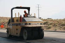 Photograph of a cement roller working on the Blackrock 4-Lane Project in 2004.