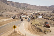 Crews clean mud from State Route 58 on October 19, 2015.