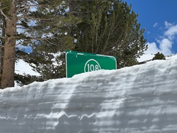 Snow blocking the view of the eastbound Sonora Pass sign on State Route 108.