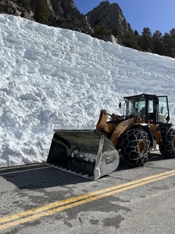 Snow plow on State Route 120 W in May 2023.