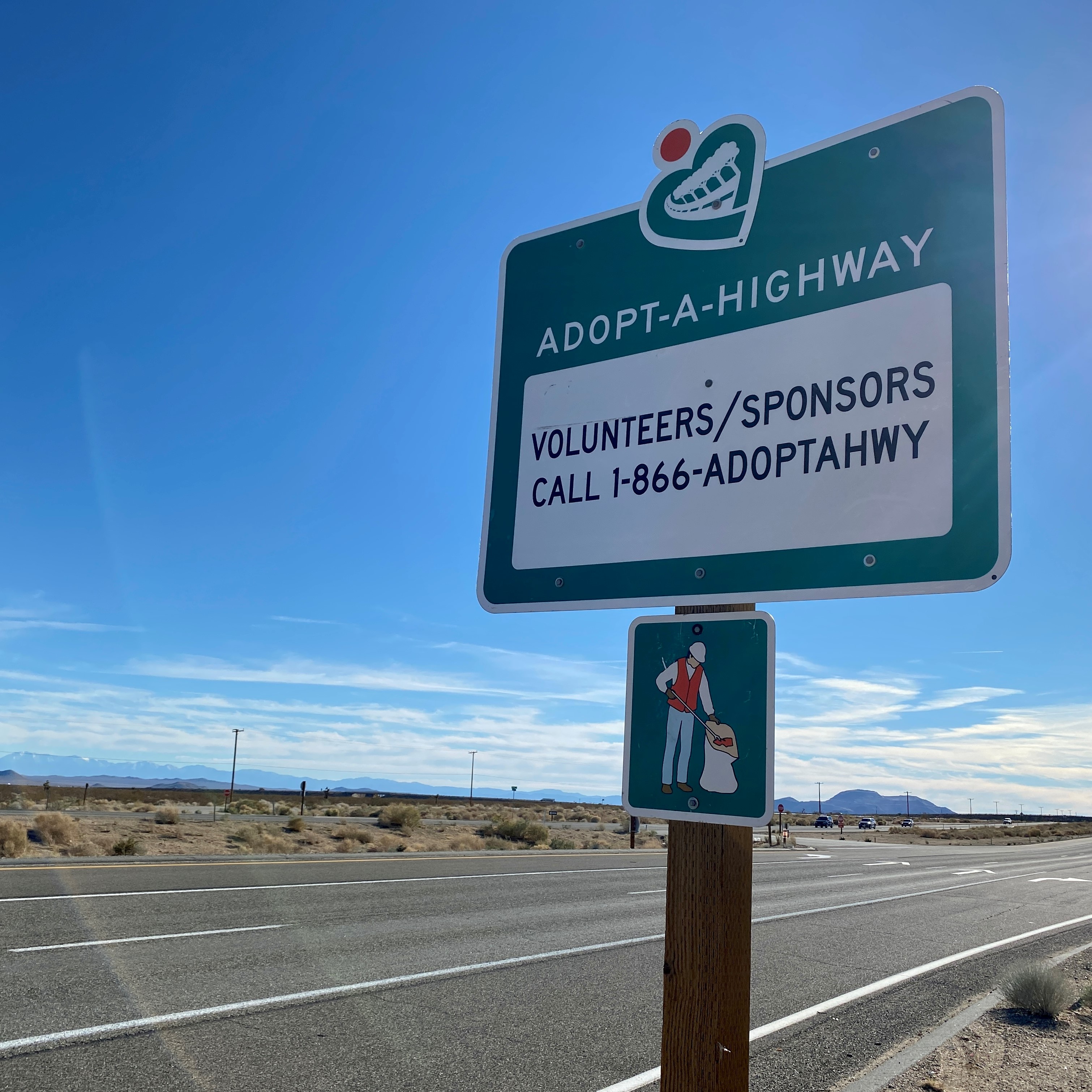 Adopt-a-Highway Sign with how to volunteer information.