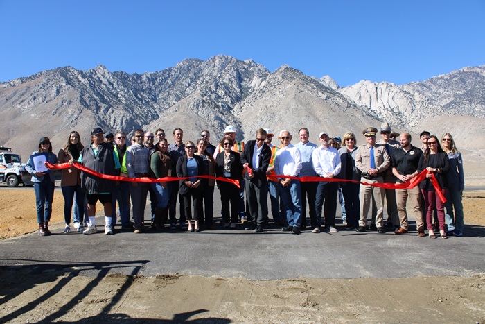 Acting District 9 Director Brandon Fitt and guests cut the ribbon along the new lanes of U.S. 395, signaling the end of major construction.