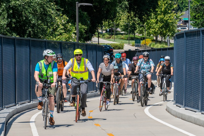 Bicyclists coming around a curve