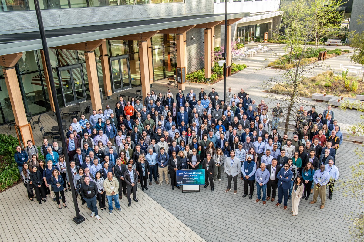 Large group photo of BIM4I Summit attendees in business attire 