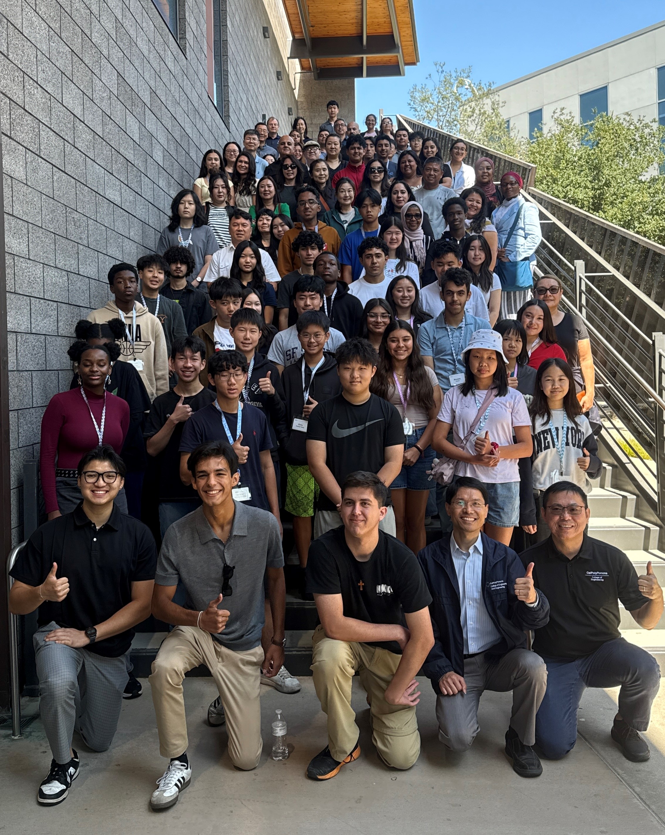Group photo of high school students with their families and Cal Poly Pomona staff on the first day of the National Summer Transportation Institute (NSTI) program, July 28, 2025
