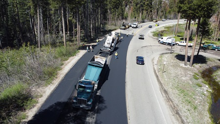 Overhead image of workers paving the highway