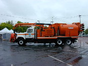 This image shows the side of a catch basin truck.