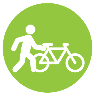 green circle with white pedestrian and bicycle icons inside