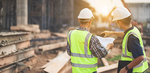 A pair of construction workers at a site