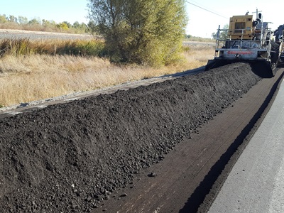 pulverized and mixed recycled pavement with additives prior to grading and compaction on a sunny day 