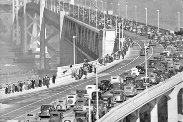 Spectators and automobile parade celebrating opening day of the San Francisco-Oakland Bay Bridge – Nov. 12, 1936.