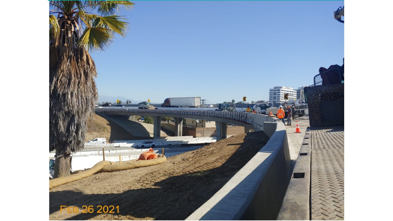 Photo of a call around a curving bridge holding a road above another road