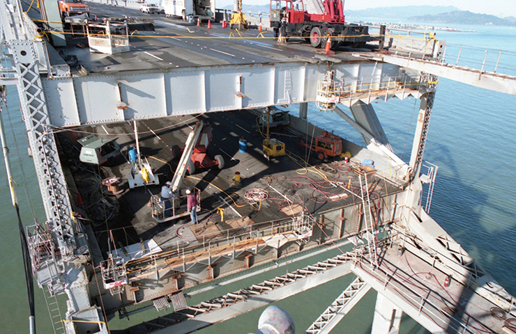 Photo shows overhead view of construction crews working to restore the San Francisco-Oakland Bay Bridge