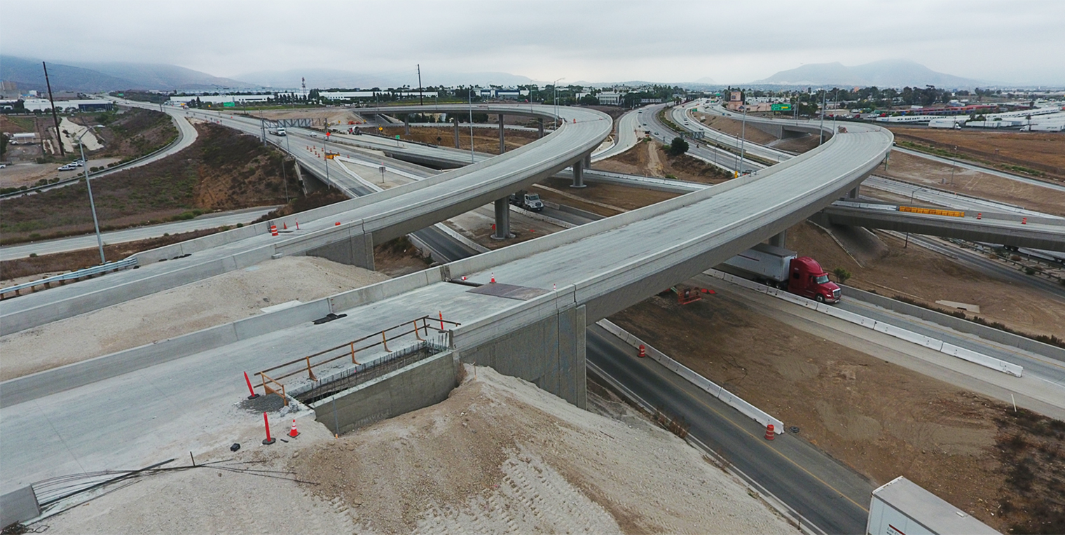 Aerial photo of two freeway overpasses at the Otay Mesa East construction site