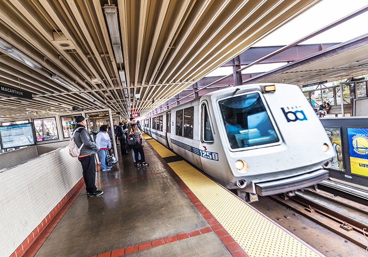 Photo showing passengers waiting for the arrival of a BART train