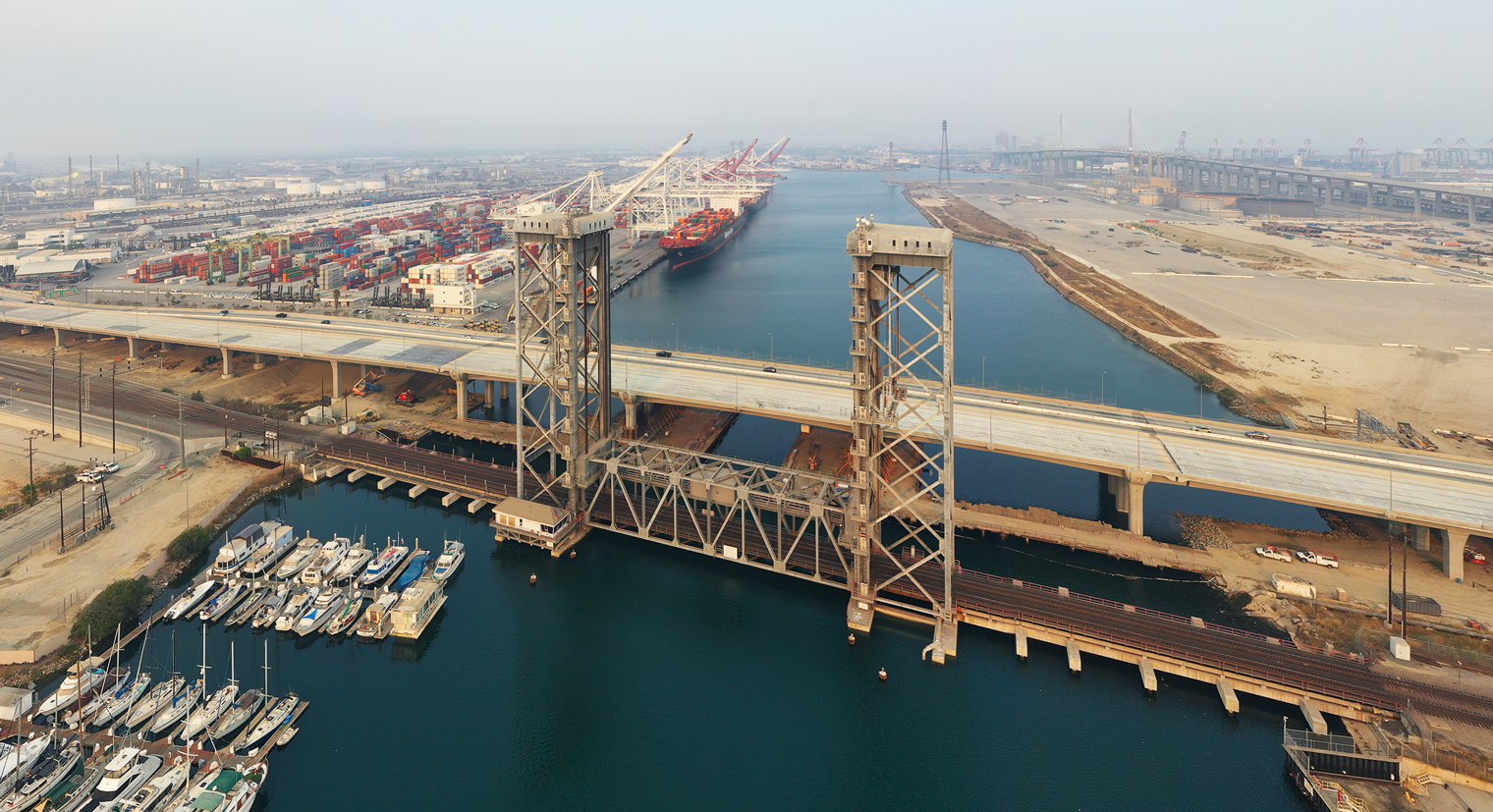Aerial view of the Commodore Schuyler F. Heim Bridge and spanning the waterway between Terminal Island and Long Beach.